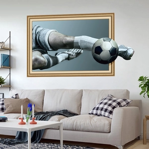 Detailed 3D wall sticker showing a soccer player kicking a ball through a gold frame effect