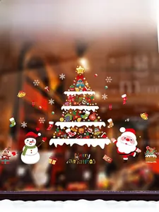 Dettaglio degli adesivi natalizi per finestre con albero di Natale e Babbo Natale decorativo