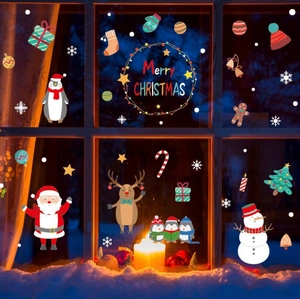Christmas window decals set featuring Santa, reindeer and snowman on a night window pane