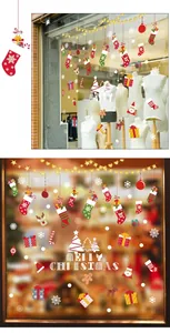Close-up of festive Merry Christmas window decals with stockings and reindeer motifs