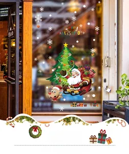 Adesivi natalizi dettagliati con Babbo Natale e renne sul vetro del negozio