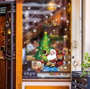 Adesivi natalizi per vetrine con Babbo Natale, renne e albero su vetro