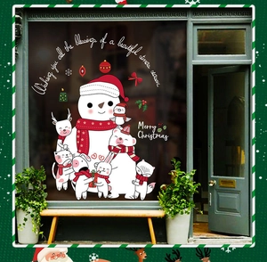 Christmas window decals set featuring snowman, deer and polar bear on a store window
