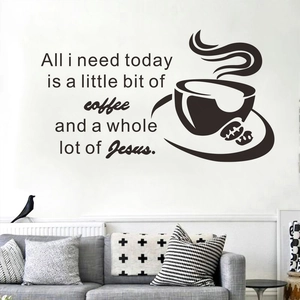 Macro view of coffee cup and quote vinyl wall sticker on a modern living room wall