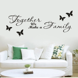 Together We Make a Family wall decal with butterflies over a white sofa in a living room