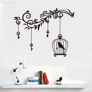 Floral vine wall sticker with birdcage and keys on a white wall in a modern living room