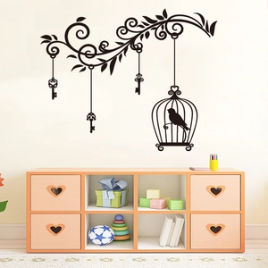 Detailed black birdcage wall sticker featuring floral vines and vintage keys on a clean wall