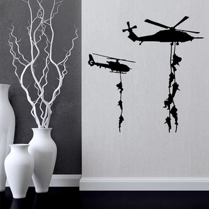 Detailed vinyl wall decal showing black military helicopters and soldiers on a white wall