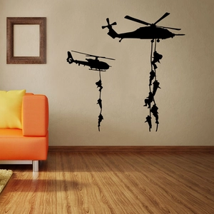 Detail of military helicopter and soldier vinyl wall sticker on a modern living room wall
