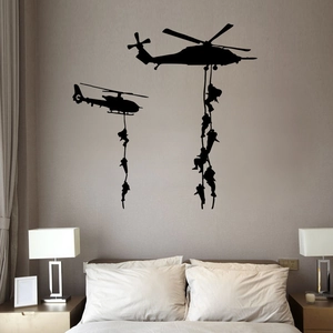 Detailed vinyl wall decal featuring black military helicopter and soldiers on bedroom wall