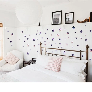 Purple starry galaxy wall decals in star shapes for bedroom and nursery decoration