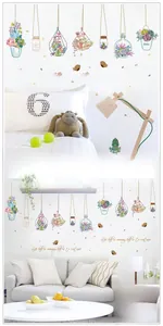 Detail of hanging succulent plant wall stickers in geometric glass pots and vases