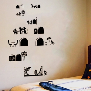 Detail of black mouse silhouette wall stickers showing personified mice on white bedroom wall
