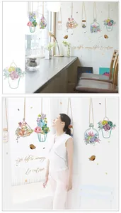 Detail showing hanging potted plants and succulent wall stickers in a cozy home setting