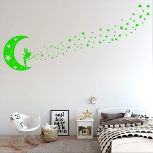 Glow in the dark wall stickers featuring green fairy and stars in a cozy kids bedroom