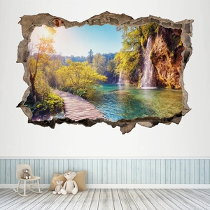 Detalle de vinilo decorativo 3D efecto pared rota con paisaje natural de bosque