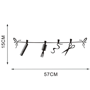 Barber shop wall decal with scissors and comb silhouettes measuring 15cm high and 57cm wide