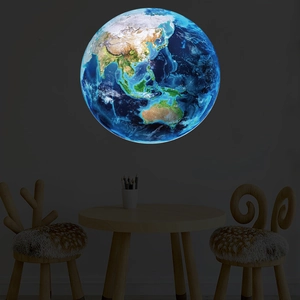 Luminous Earth wall decal showing Asia and Oceania glowing in a dark kid's bedroom