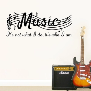 Music themed vinyl wall decal featuring musical notes and inspirational quote on wall