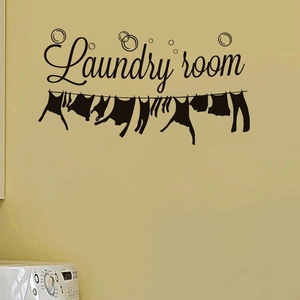 Laundry room wall decal with hanging clothes line and bubbles on light yellow wall