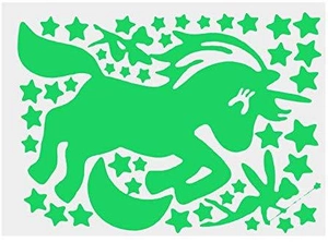 Detailed sheet of glow-in-the-dark stickers featuring a unicorn, fairy, and various stars