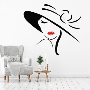 Modern vinyl wall decal of a woman in a wide-brim hat with red lips on a living room wall