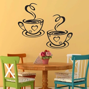 Two-piece black coffee cup wall stickers set with heart motifs on a yellow wall