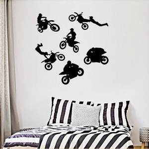 Macro detail of six black vinyl motocross stunt silhouette wall decals for home decor