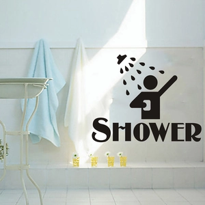 Close-up of black vinyl shower wall decal on white bathroom tiles with modern icons