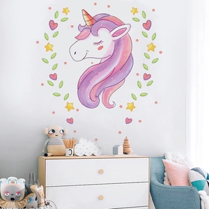 Dreamy watercolor unicorn wall decal for kids room featuring stars and hearts on a white wall