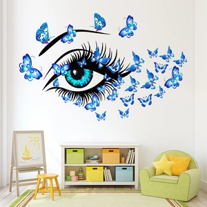 Creative wall sticker featuring a large blue eye and vibrant butterflies for living rooms