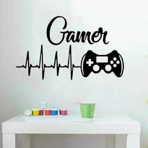 Close-up of Gamer vinyl wall sticker with heartbeat line and controller on white wall