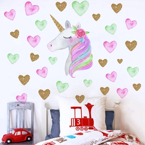 Luminous gold unicorn wall sticker set with colorful stars and hearts for kids' bedrooms