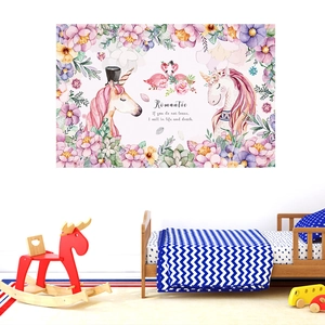 Detail view of unicorn and flamingo wall stickers decorating a cozy children bedroom