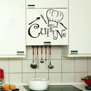 Detail of Cuisine wall decal with chef hat and cutlery icons on white kitchen cabinet