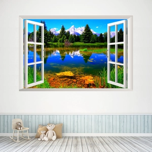 Macro detail of a 3D window wall sticker showing snowy mountains and a blue forest lake