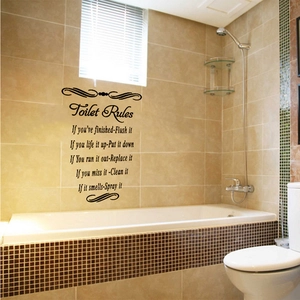 Detail showing 'Toilet Rules' humorous bathroom wall sticker on a tiled background
