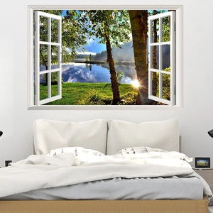 Detail of 3D window wall decal showing a serene forest lake and sunset view in a bedroom
