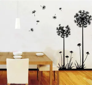 Detail showing black dandelion wall decal silhouettes in a modern dining room setting