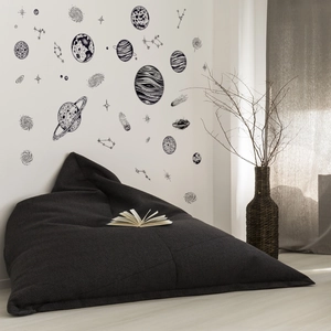 Deep gray oversized bean bag chair paired with creative outer space themed wall stickers