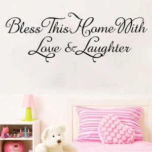 Bless This Home With Love & Laughter wall decal in elegant black cursive script for decor