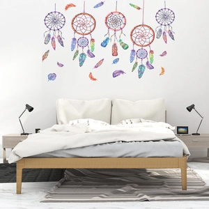 Detail of watercolor dreamcatcher wall decals with feathers for a cozy bedroom decoration