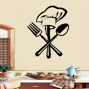 Wall sticker detail showing a minimalist black chef hat with cutlery for kitchen decor