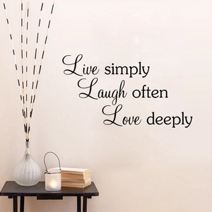 Live simply wall decal featuring inspirational quotes on a minimalist living room wall