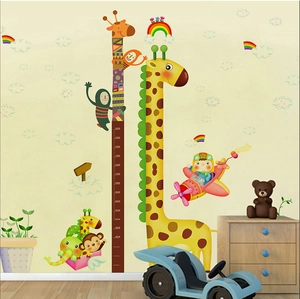 Detail of cartoon animal height chart featuring giraffe and elephant for kids room