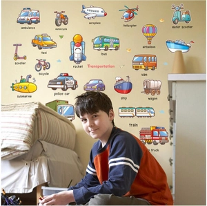 Detail of colorful cartoon transport wall stickers for kids with vehicle names in a bedroom