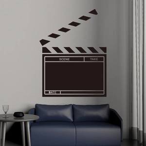 Detail view of movie clapperboard wall sticker in a modern living room setting