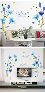 Detail showing blue lily floral wall stickers with butterflies and artistic lettering