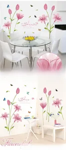 Detailed view of pink lily wall stickers with green leaves and butterflies in a modern room