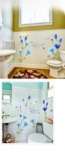 Detail of blue lily flower wall sticker with butterflies and romantic art text
